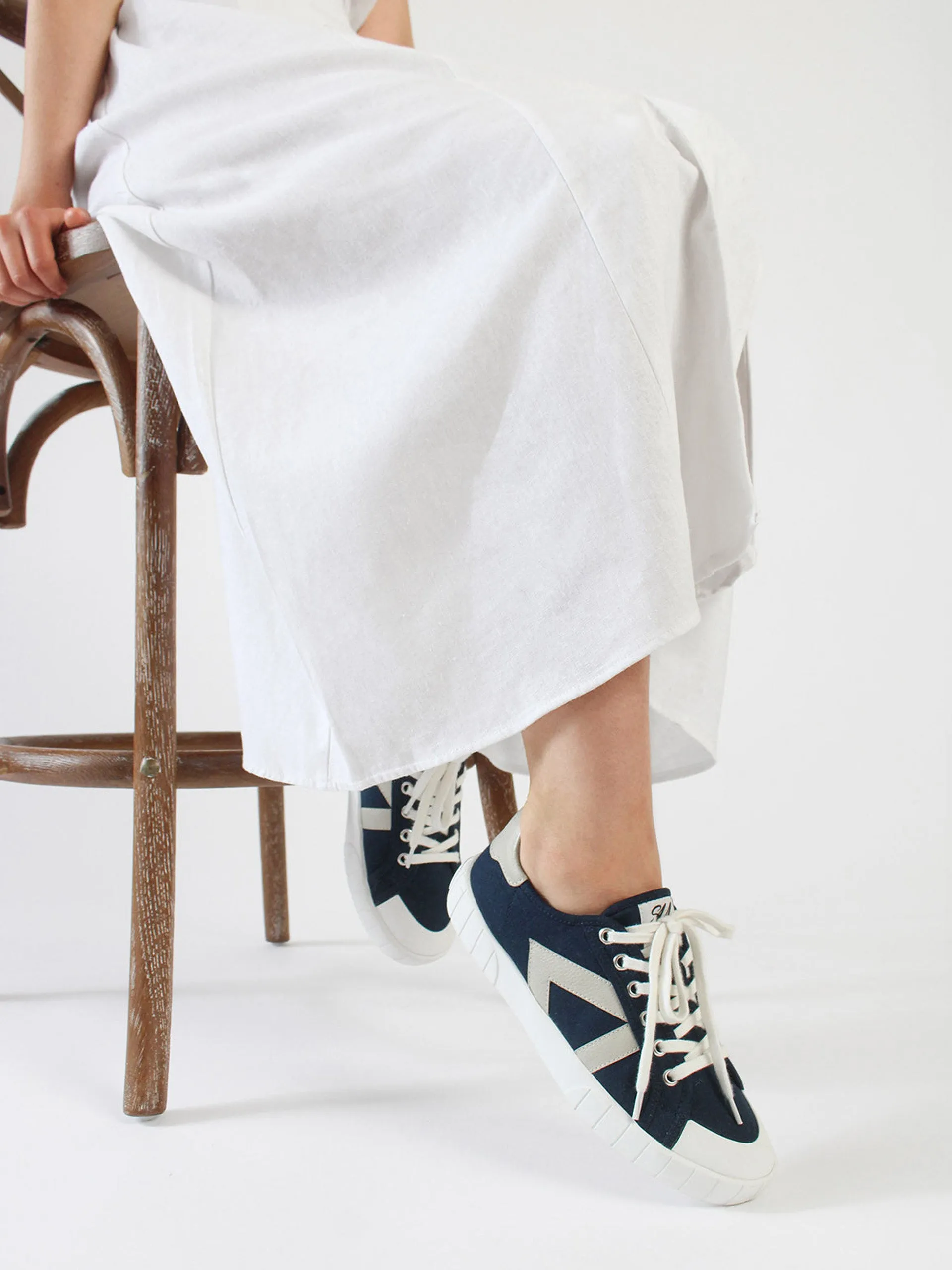 The Helios navy and beige trainers