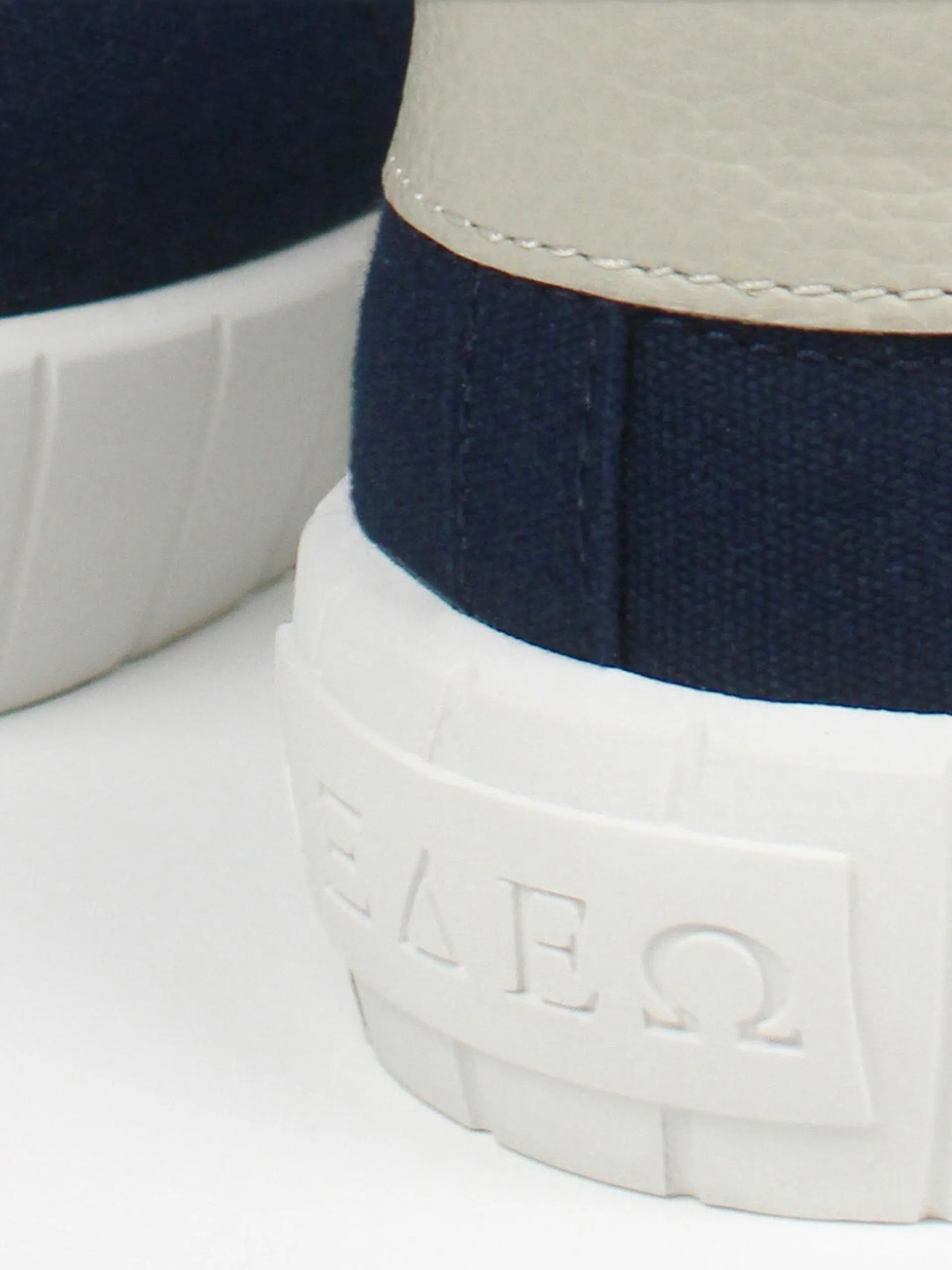 The Helios navy and beige trainers